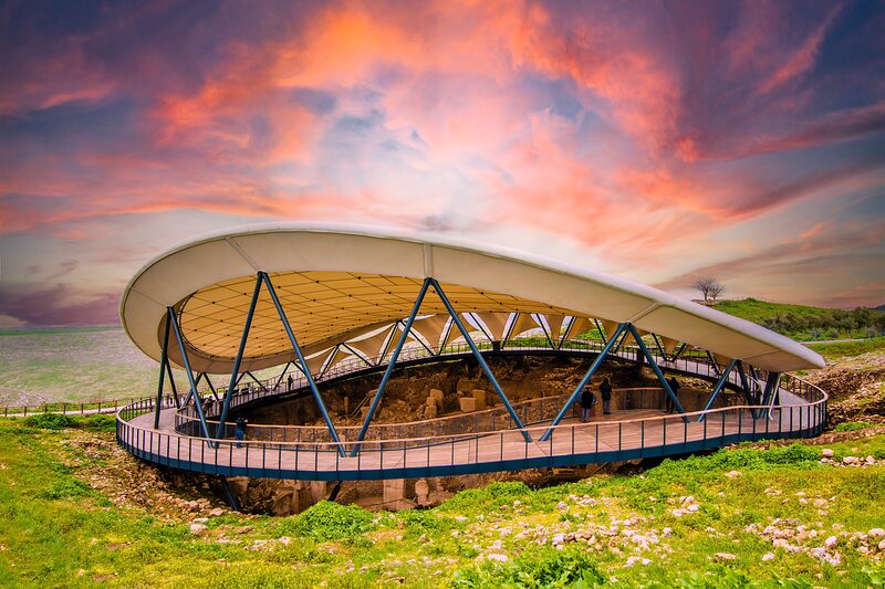 The canopy that shelters Enclosures A–D from sun and rain, at dusk