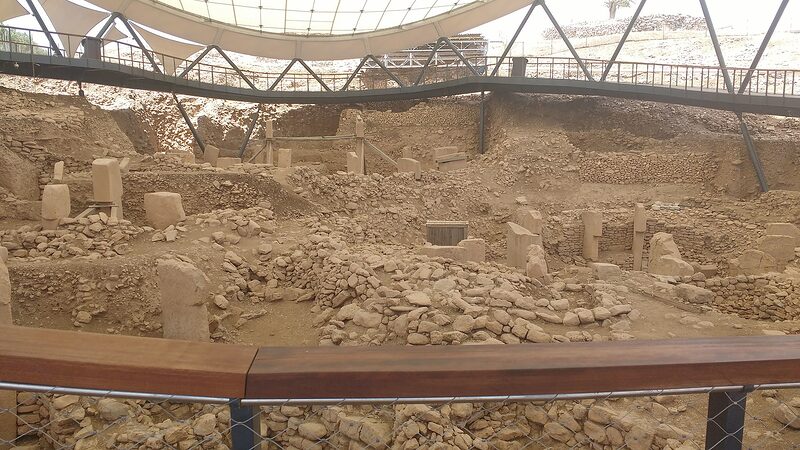 Excavated enclosures under the protective canopy